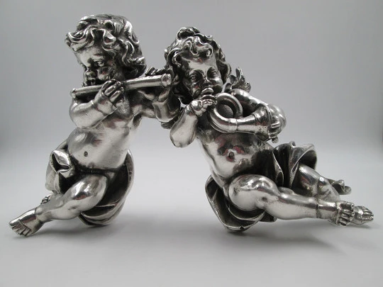 Pair of sculptures. Sterling silver laminated. Cherubs musicians. 1970's