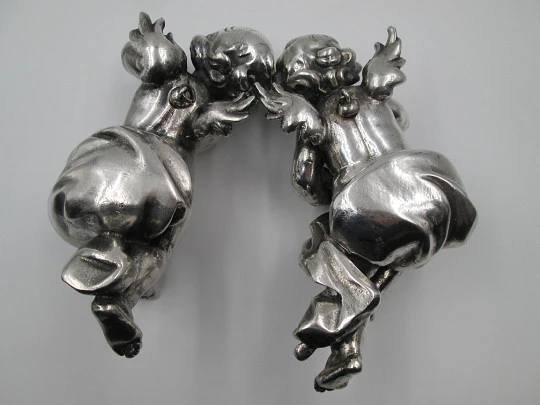 Pair of sculptures. Sterling silver laminated. Cherubs musicians. 1970's