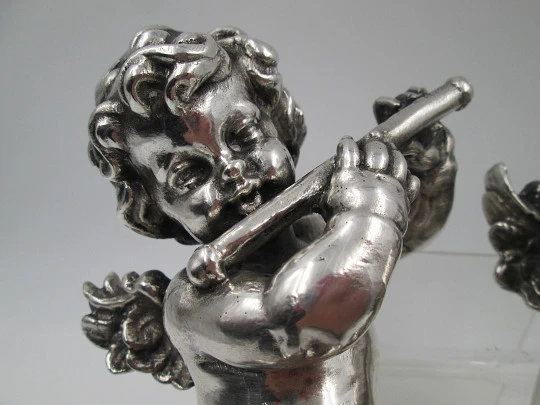 Pair of sculptures. Sterling silver laminated. Cherubs musicians. 1970's