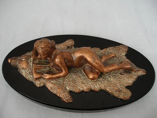 Paperweight. Bronze sculpture. Woman lying on bearskin. 1970's