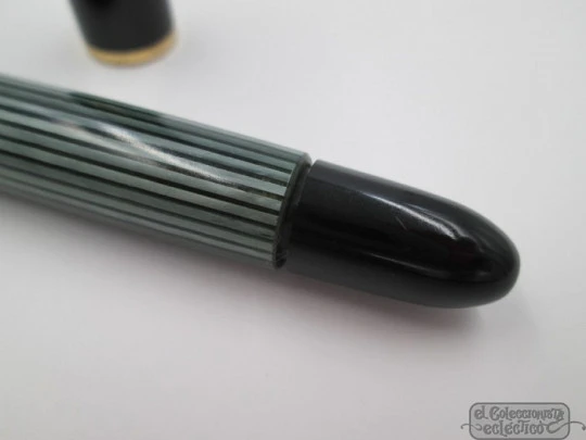 Pelikan 140. Green & black resin. Gold plated details. 1950's. Piston filler. 14K Pelikan 140. Green & black resin. Gold plated details. 1950's. Piston filler. 14K