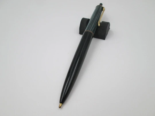 Pelikan 355 ballpoint pen. Green & black striped resin. Gold plated details. Push button