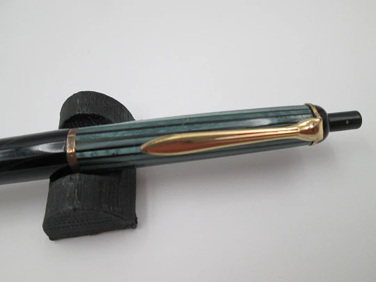 Pelikan 355 ballpoint pen. Green & black striped resin. Gold plated details. Push button