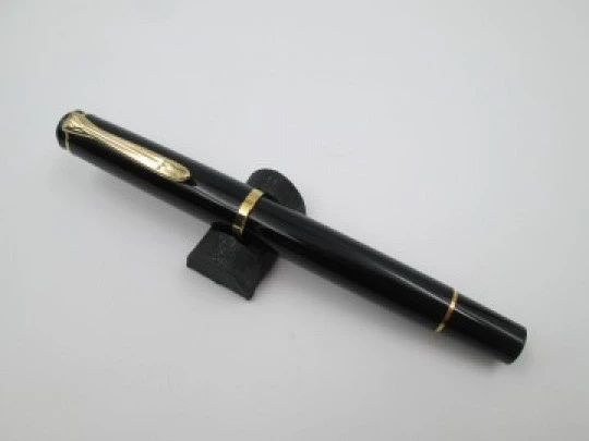 Pelikan Classic M200 fountain pen. Black resin. 24k gold plated details. Piston filler