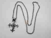 Pendant crucifix with braided links chain. Sterling silver. Thick ring on top. 1980's. Spain