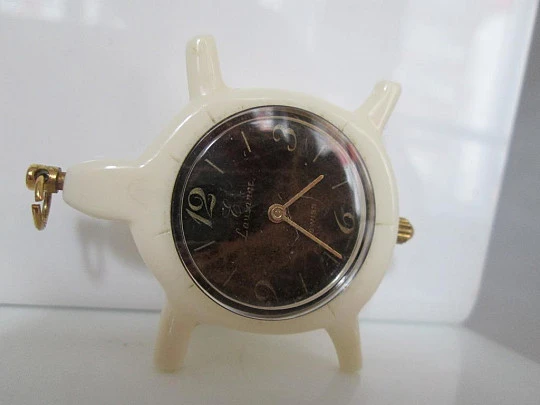 Pendant watch Lausanne. White resin. Golden metal. Turtle