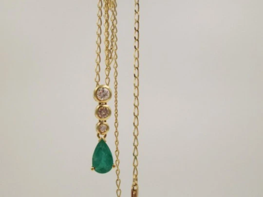 Pendant with chain. 18K gold, diamonds and emerald. 1990's