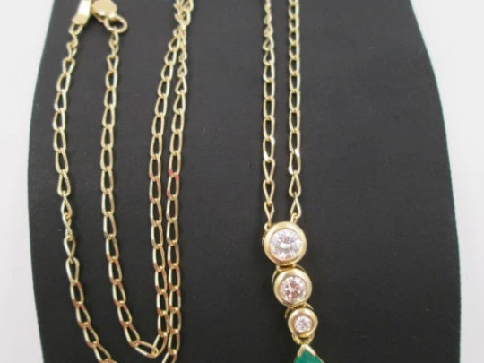 Pendant with chain. 18K gold, diamonds and emerald. 1990's