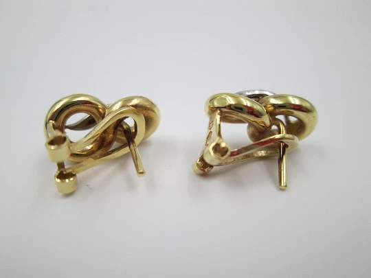 Pendientes mujer lazo. Oro amarillo y blanco 18k y diamantes. Cierre Omega