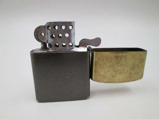 Penguin petrol pocket lighter. Golden and black brass. Ford T car motif. Japan. 1980's