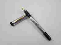 Pierre Cardin fountain pen. Silver and gold plated. Black resin. Cartridge. 1980's