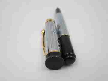 Pierre Cardin fountain pen. Silver and gold plated. Black resin. Cartridge. 1980's