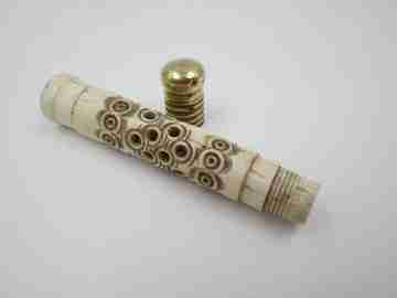 Pincushion. Carved openwork bone and golden metal. Circular pattern