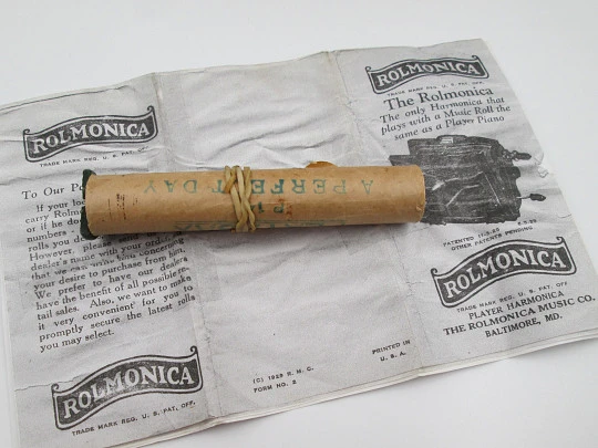 PlaRola Organ armónica portátil automática. Hojalata litografiada. Rollos perforados. 1930