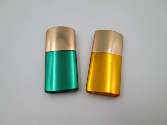 Pocket petrol lighter couple. Golden brass caps and colour lacquer bodies. Europe. 1960's