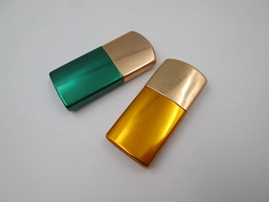 Pocket petrol lighter couple. Golden brass caps and colour lacquer bodies. Europe. 1960's