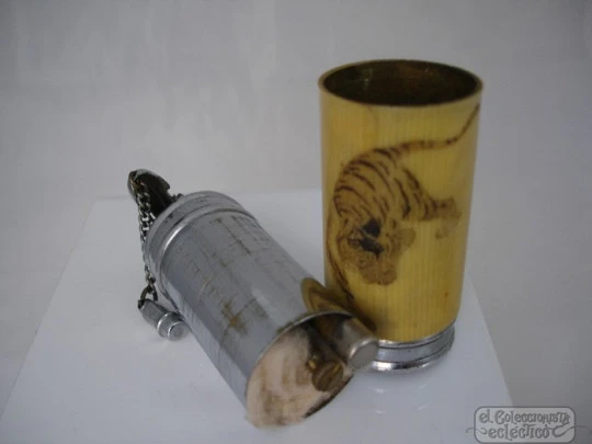 Pocket petrol lighter. Silver-plated and resin. 1940's. Tiger motif Pocket petrol lighter. Silver-plated and resin. 1940's. Tiger motif