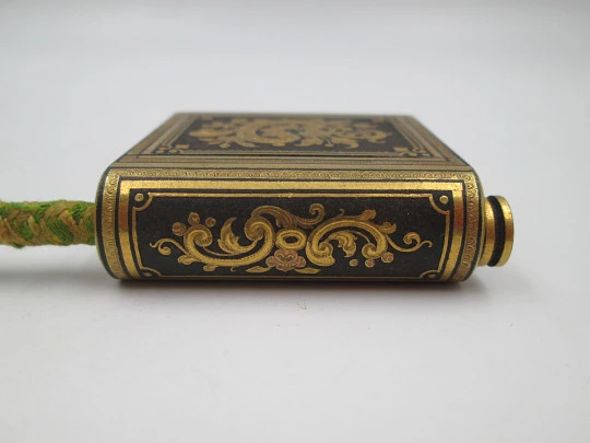 Pocket vesta case with wick and match striker. Damascene-patterned metal. 1930's Pocket vesta case with wick and match striker. Damascene-patterned metal. 1930's