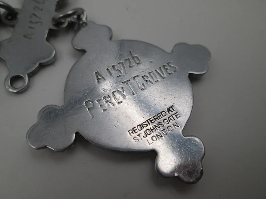 Pocket watch chain with St John Ambulance medal and yearly examination bars. 1950's