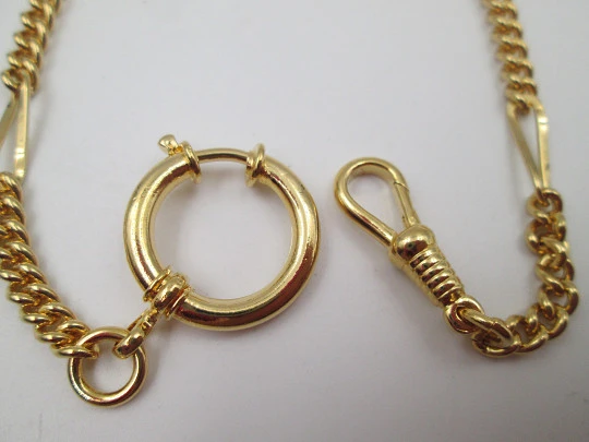 Pocket watch chain. Gold plated metal. Links and figure eights. Spring ring clasp. 1980's Pocket watch chain. Gold plated metal. Links and figure eights. Spring ring clasp. 1980's