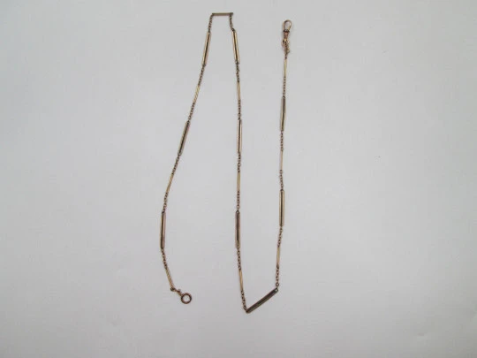 Pocket watch chain. Gold plated metal. Links and openwork rectangles. Carabiner. 1920's