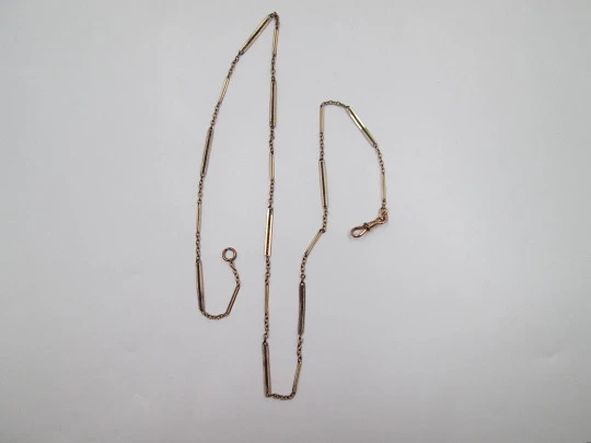 Pocket watch chain. Gold plated metal. Links and openwork rectangles. Carabiner. 1920's