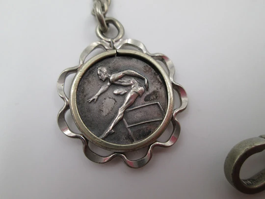 Pocket watch chain. Silver plated. Hurdle jumper pendant. 1920