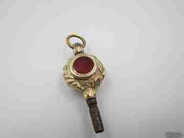 Pocket watch key fob. Gold plated. 19th century. Colour stones and leaves