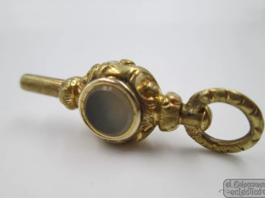 Pocket watch key fob. Gold plated. 19th century. Grey and amber stones