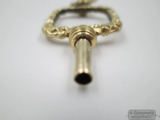 Pocket watch key fob. Gold plated. 19th century. Openwork. Square design