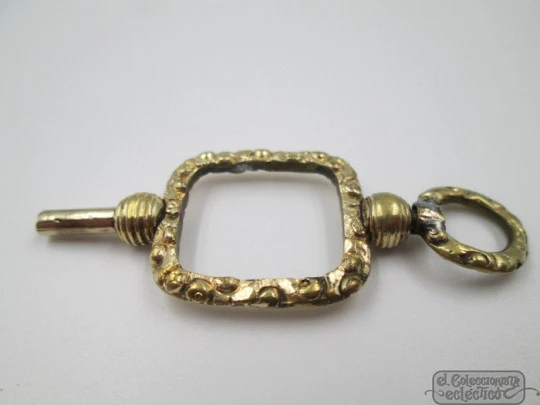 Pocket watch key fob. Gold plated. 19th century. Openwork. Square design