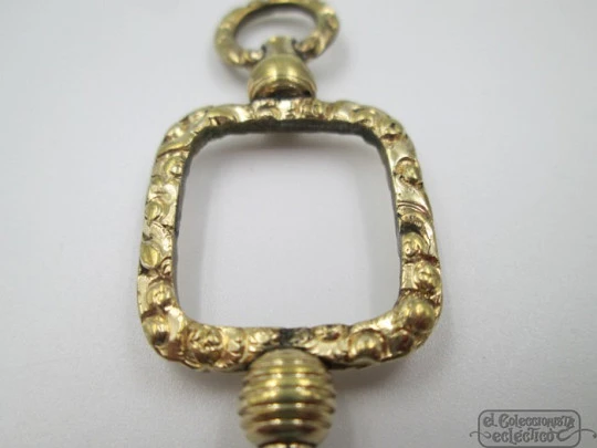 Pocket watch key fob. Gold plated. 19th century. Openwork. Square design