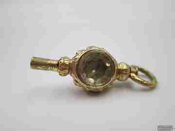 Pocket watch key. Gold plated. 19th century. White stone & champagne glass