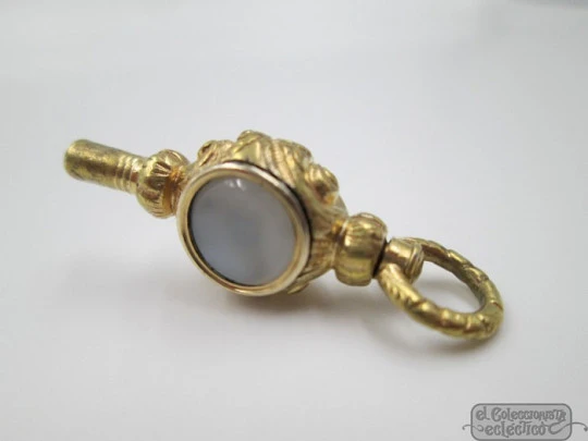 Pocket watch key. Gold plated. 19th century. White stone & champagne glass