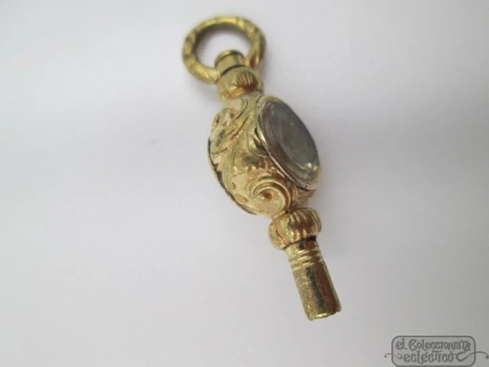 Pocket watch key. Gold plated. 19th century. White stone & champagne glass