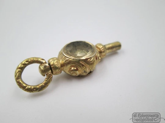 Pocket watch key. Gold plated. 19th century. White stone & champagne glass