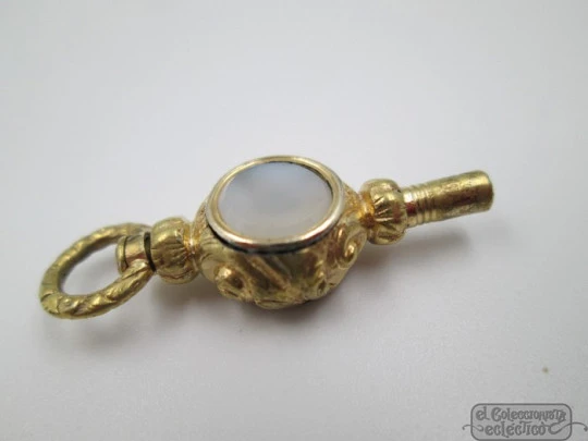 Pocket watch key. Gold plated. 19th century. White stone & champagne glass