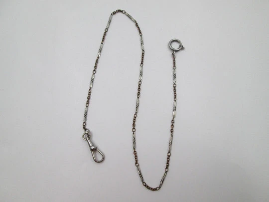 Pocket watch spiral links chain. Golden and silver plated metal. Carabiner clasp. Europe