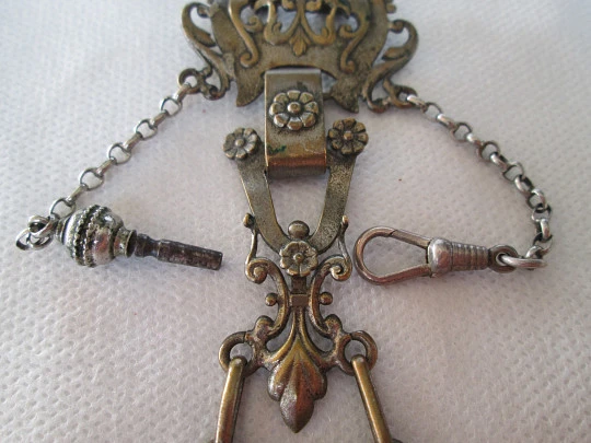 Pocket watch with chatelaine. Silver plated metal. Key-wind. 19th century