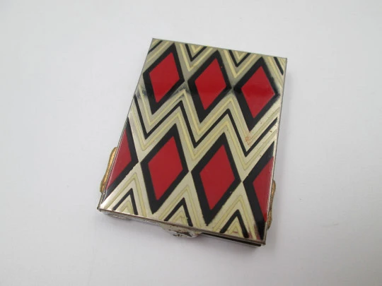 Polvera art decó Pierrette para mujer. Metal plateado y esmalte de colores. Europa. 1920