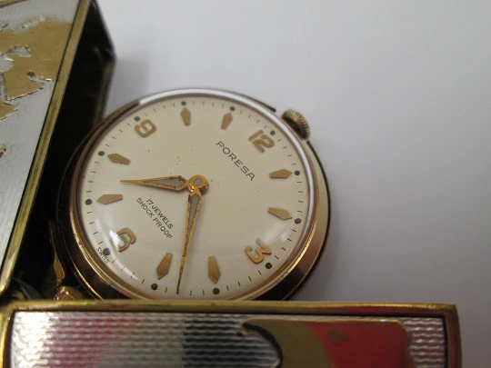 Poresa 'World map' travel watch. Silver plated and golden. Manual wind. 1960's
