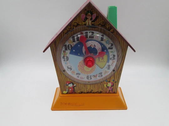 Puck children's musical clock with money box. Lithographed tinplate & plastic. Rico. 1970's