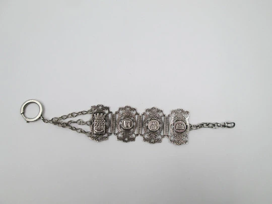 Pulsera articulada calada. Plata de ley. Escudo y escenas de Paris. 1900.