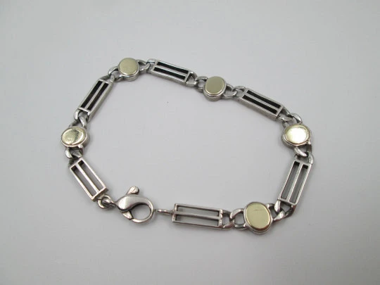 Pulsera articulada mujer. Plata ley y laminados oro. Óvalos y rectángulos calados. 1960