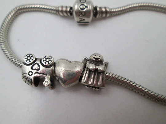 Pulsera cordón mujer Pandora. Plata de ley 925. Cierre oculto. Corazón y querubín
