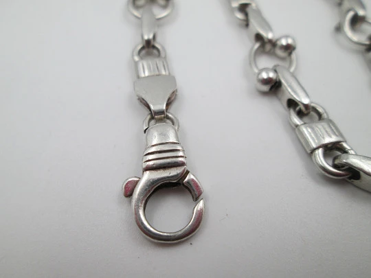 Pulsera de eslabones para mujer en plata de ley. Motivos de aros y bolas. Cierre argolla