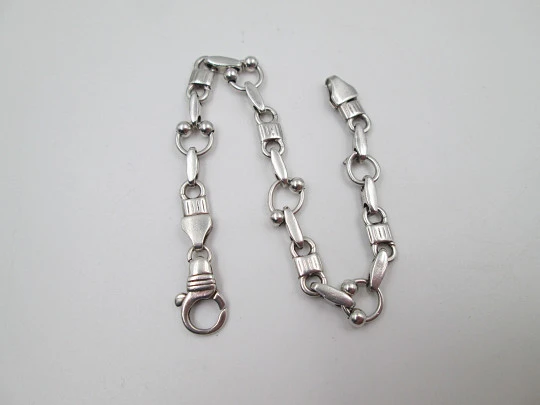 Pulsera de eslabones para mujer en plata de ley. Motivos de aros y bolas. Cierre argolla