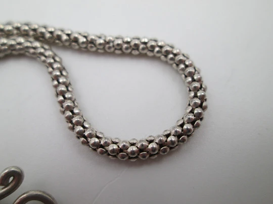 Pulsera mujer de cordón en plata de ley. Adorno cascabel. Cierre argolla en ocho