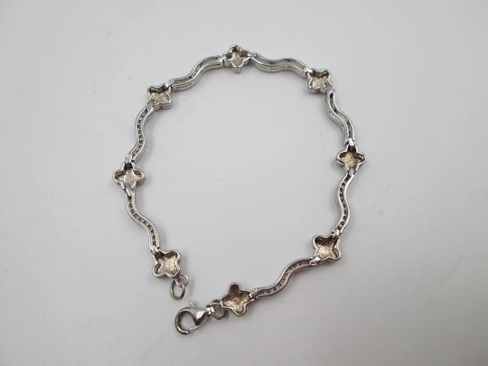 Pulsera para mujer en plata de ley. Motivos de estrellas y pedrería blanca. 1990. Europa