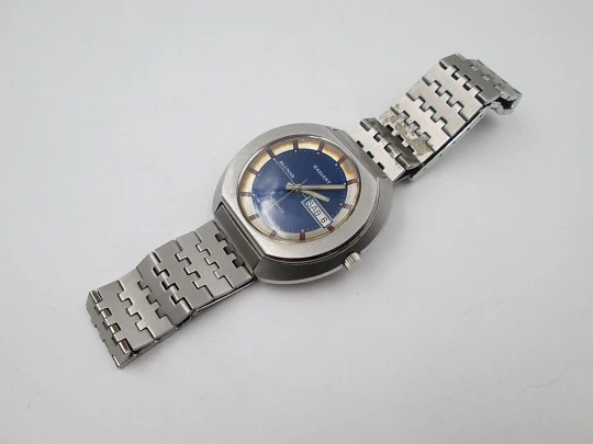 Radiant Blumar. Acero. Caja elíptica. Automático. Calendario. Brazalete. 1970